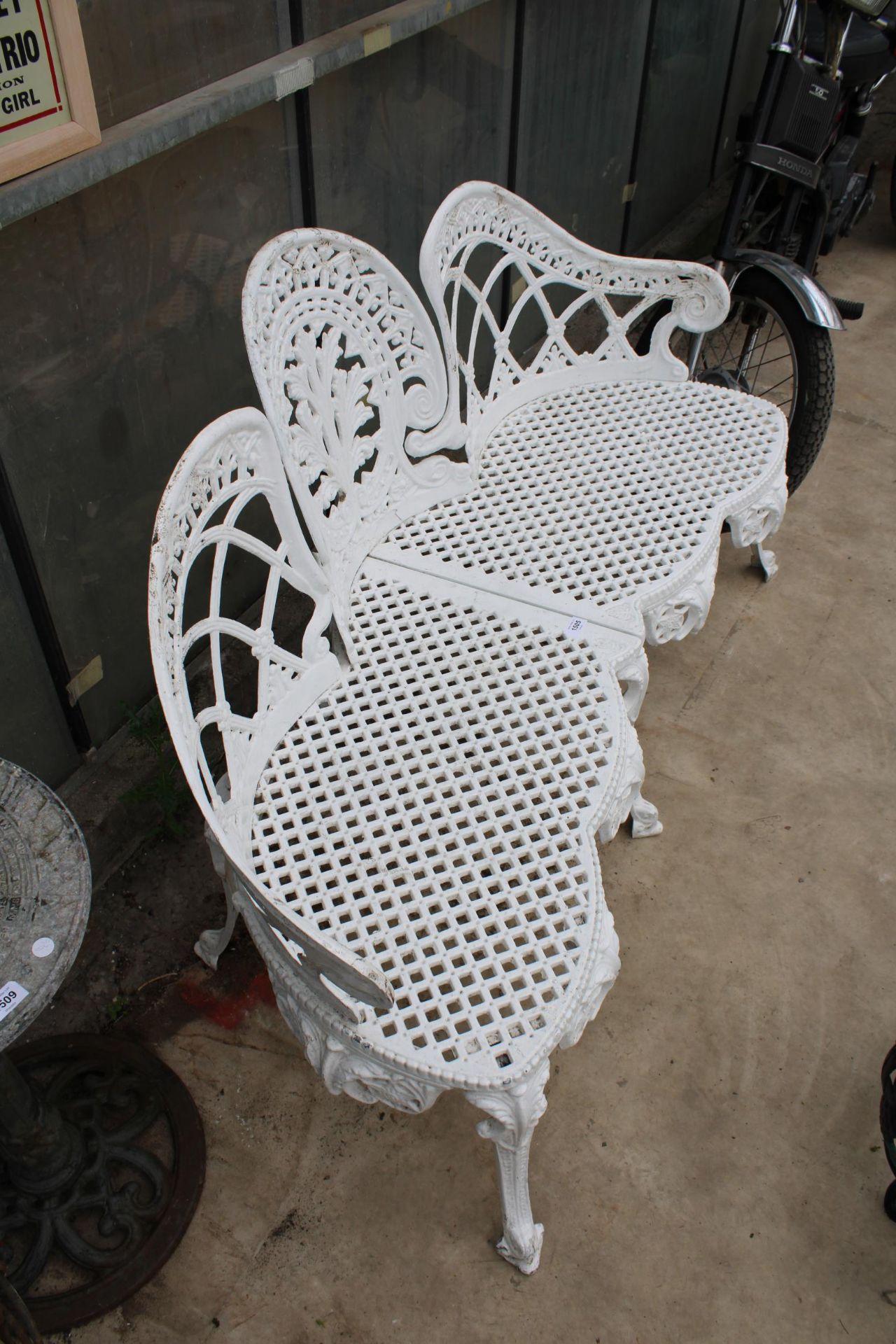 A DECORATIVE WHITE PAINTED CAST ALLOY THREE SEATER BENCH - Image 3 of 3