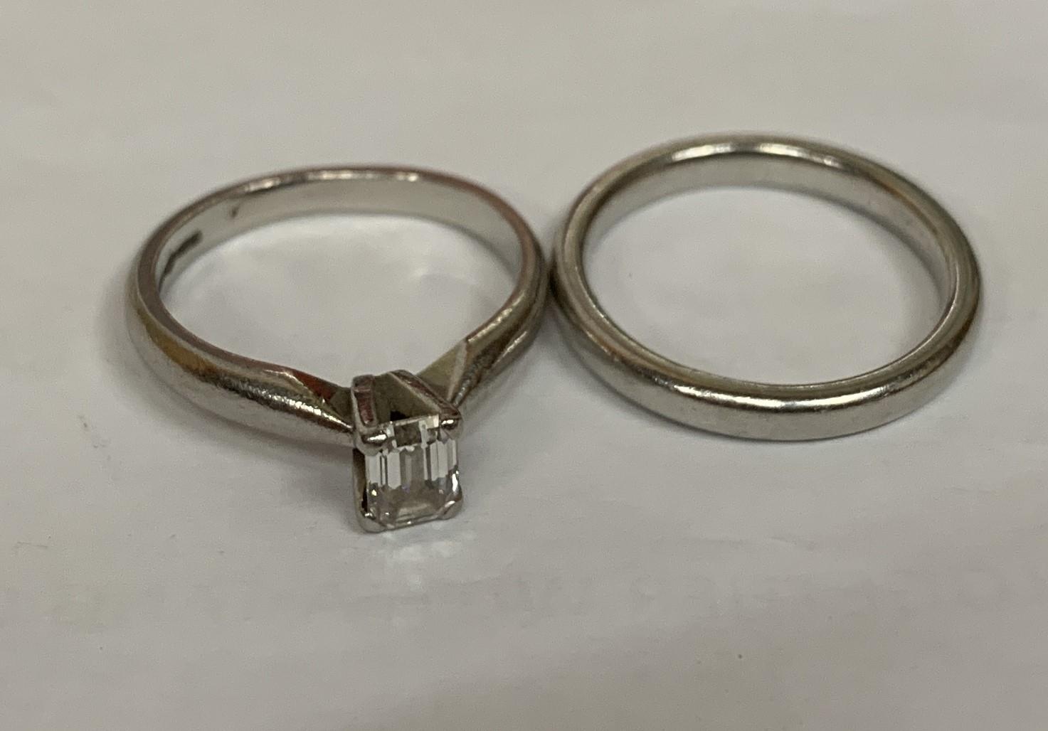 A LADIES' SET OF TWO PLATINUM RINGS, ONE SET WITH AN APPROXIMATELY HALF CARAT DIAMOND AND ONE A BAND - Image 2 of 2