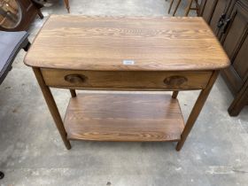 A BLONDE ERCOL SIDE TABLE WITH SINGLE DRAWER AND POT BOARD, 31" WIDE