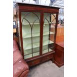 AN EDWARDIAN MAHOGANY TWO DOOR DISPLAY CABINET WITH TWO DRAWERS TO BASE AND DENTIL CORNICE, 44" WIDE