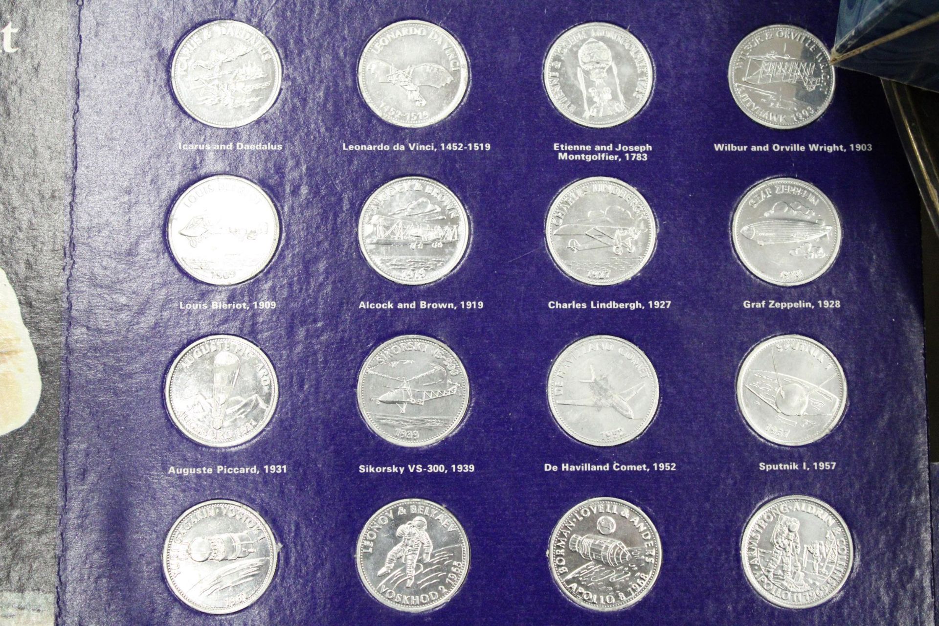 THREE SETS OF SHELL COLLECTABLE COINS ON CARDS, TO INCLUDE MAN'S FIRST FLIGHT X 2 AND HISTORIC CARS - Image 2 of 7