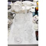 A LARGE QUANTITY OF GLASSWARE, THE MAJORITY CUT GLASS TO INCLUDE VASES, BOWLS, JUGS, CANDLE HOLDERS,