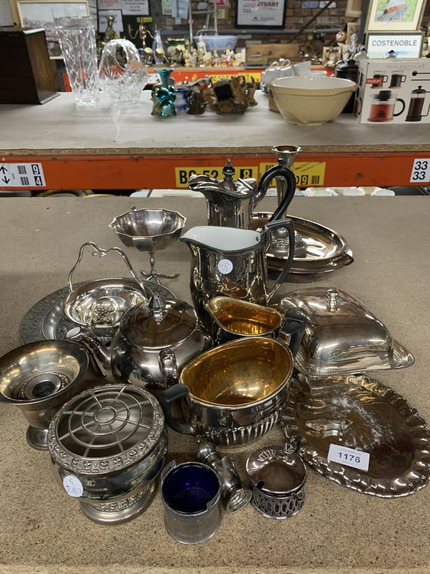 A LARGE MIXED LOT OF SILVER PLATE TO INCLUDE A CANDLE STICK, BUTTER DISH, ROSE BOWL, CAKE PLATE ETC,