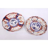 TWO ANTIQUE JAPANESE IMARI HAND PAINTED LOBED EDGED PLATES - 21 AND 22 CM