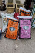 FOUR VARIOUS BAGS OF COMPOST AND A BAG OF BARK