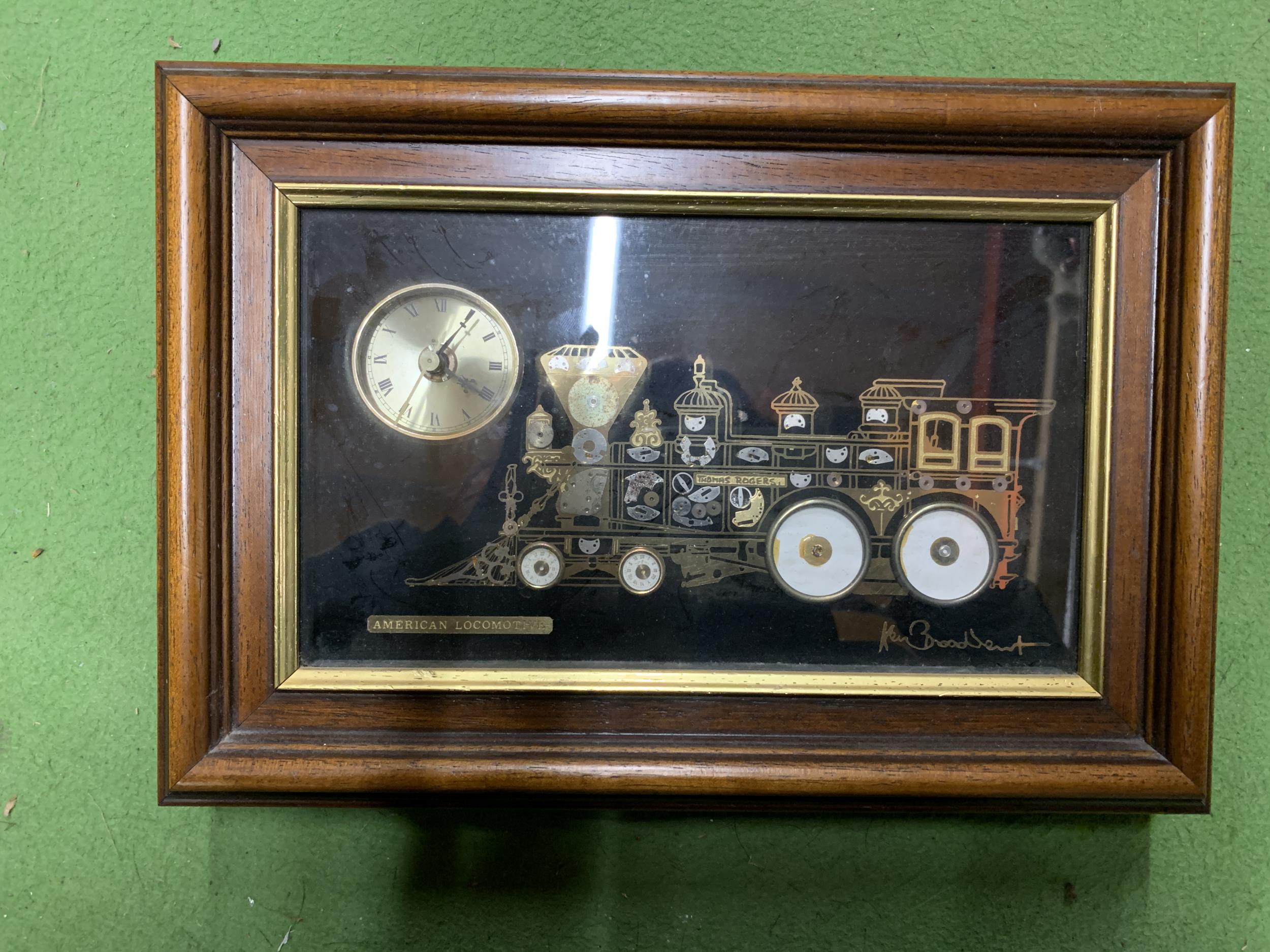 A FRAMED 'AMERICAN LOCOMOTIVE' CLOCK