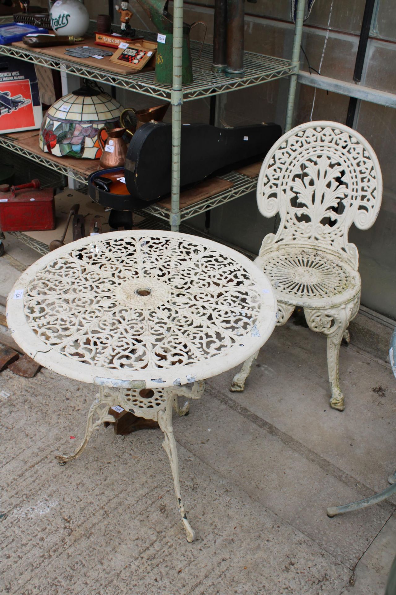 A CAST ALLOY BISTRO SET COMPRISING OF A ROUND TABLE AND ONE CHAIR - Image 2 of 3