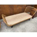 AN ERCOL BLUE LABEL BLONDE 3'6" WINDSOR STYLE BED