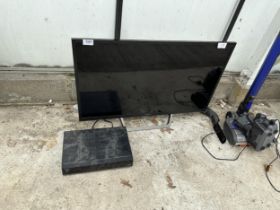 A SONY 32" TELEVISION WITH A GOODMANS FREEVIEW BOX