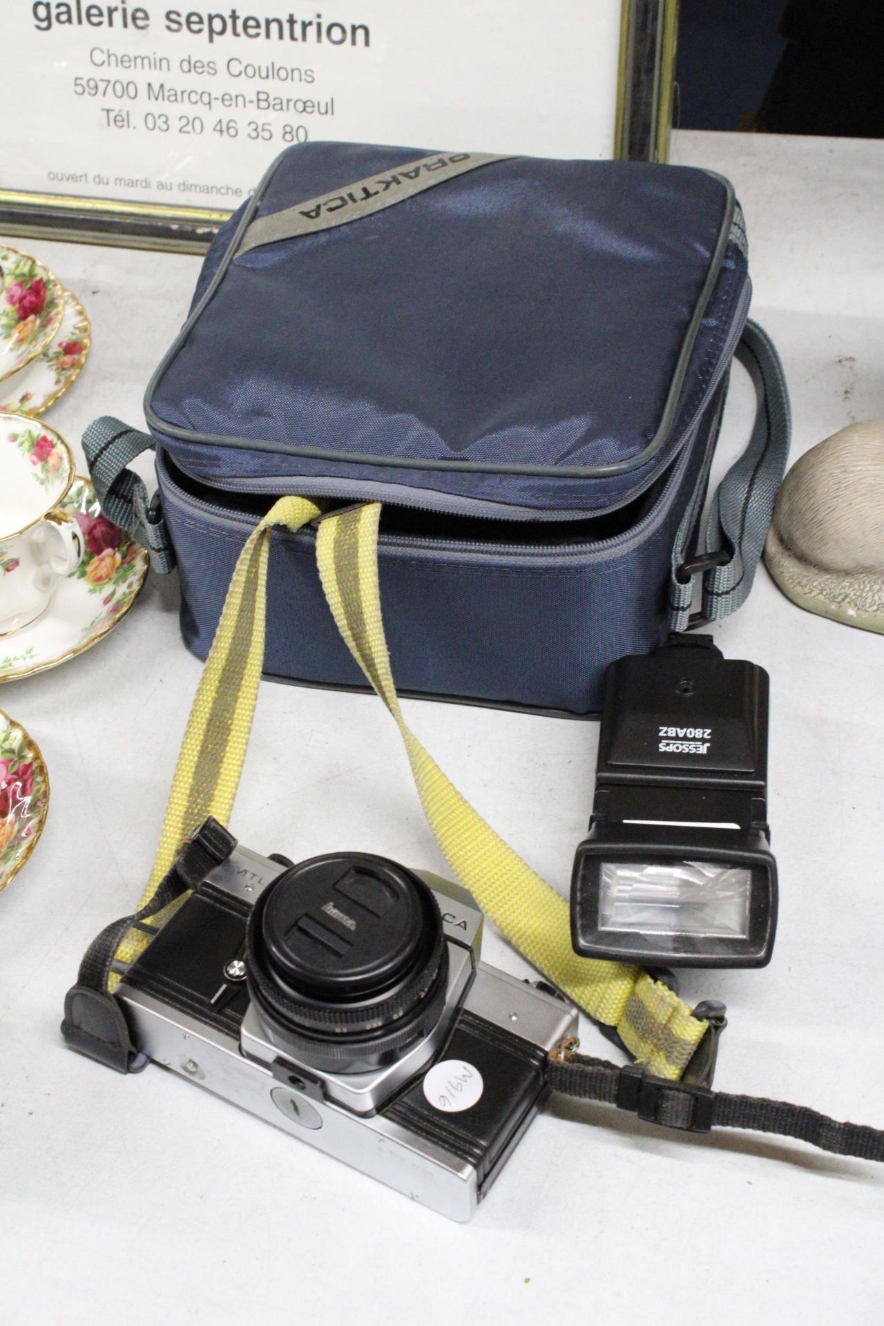 A PRAKTICA MTL 5 B CAMERA, WITH LENS, A FLASH AND PRAKTICA CAMERA BAG