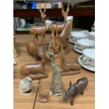 A QUANTITY OF TREEN ANIMALS TO INCLUDE DEER, TWO RHINOCEROUS, A HORN BIRD AND HORN ELEPHANT BOTTLE