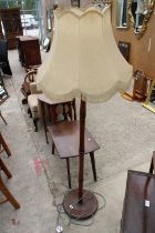 A SMALL OAK COFFEE TABLE AND STANDARD LAMP WITH SHADE