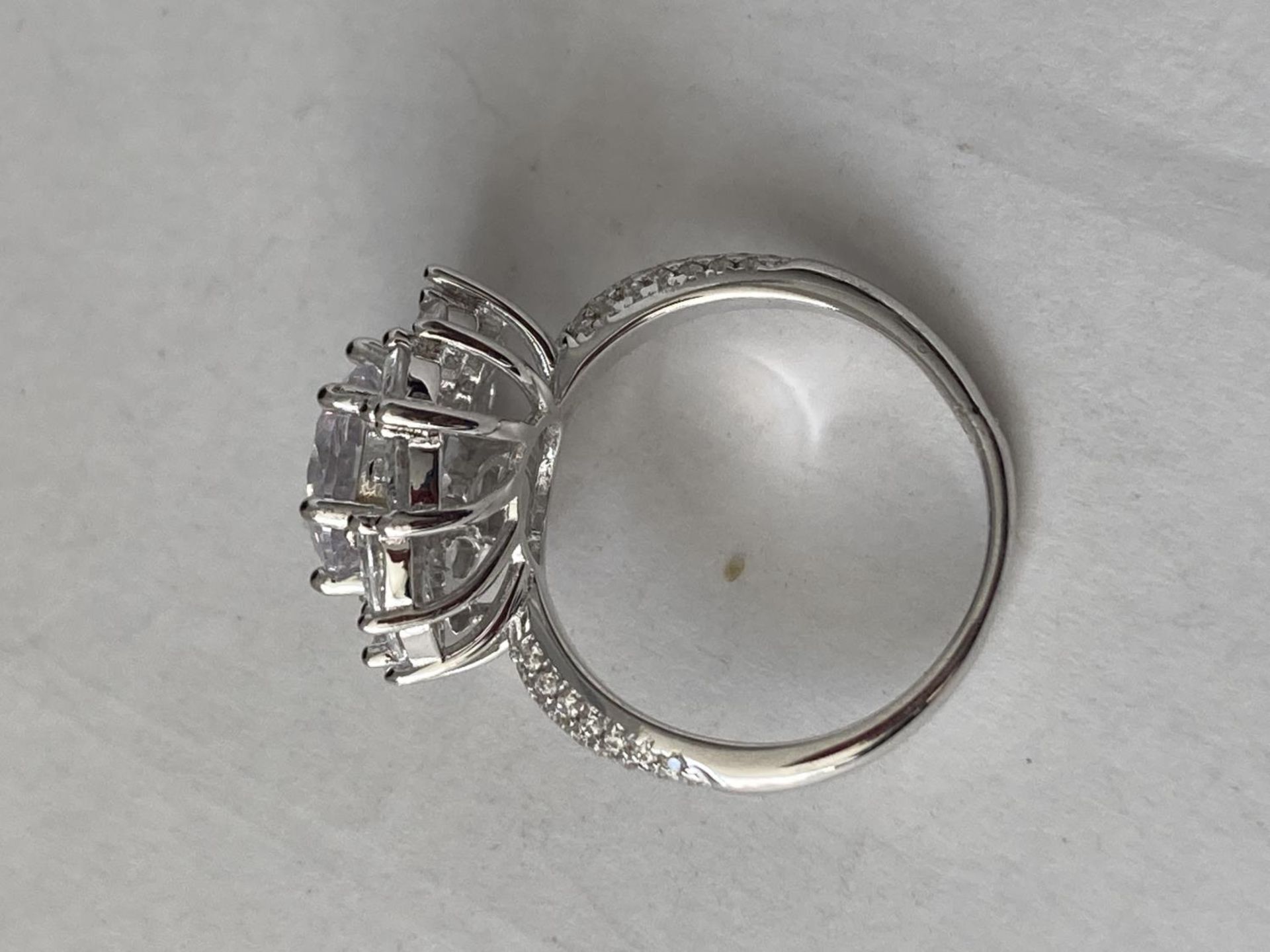 A WHITE METAL RING WITH 3 CARATS OF MOISSANITE IN A FLOWER DESIGN AND ON THE SHOULDERS SIZE P/Q - Image 6 of 8