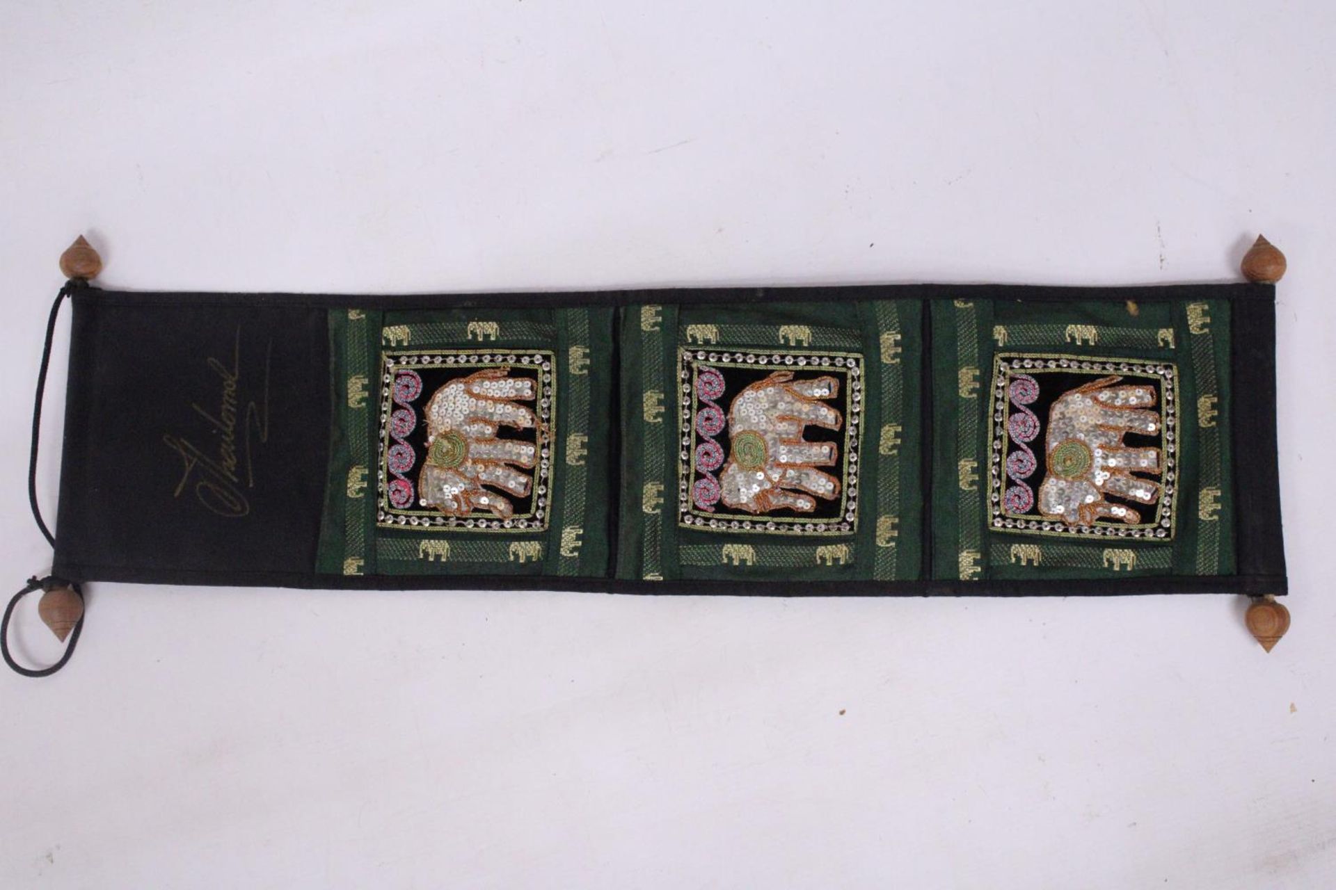 A VINTAGE THAI FABRIC WALL HANGING THREE POCKET ORGANIZER WITH ELEPHANT DECORATION