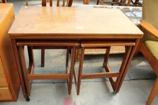 A RETRO TEAK McINTOSH NEST OF THREE TABLES WITH FOLD-OVER TOP