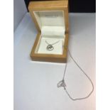 A WHITE ICE SILVER AND DIAMOND NECKLACE WITH HEART PENDANT CONTAINING TWO DIAMONDS IN AN ORIGINAL