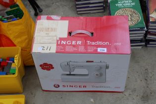 A BOXED ELECTRIC SINGER TRADITION SEWING MACHINE