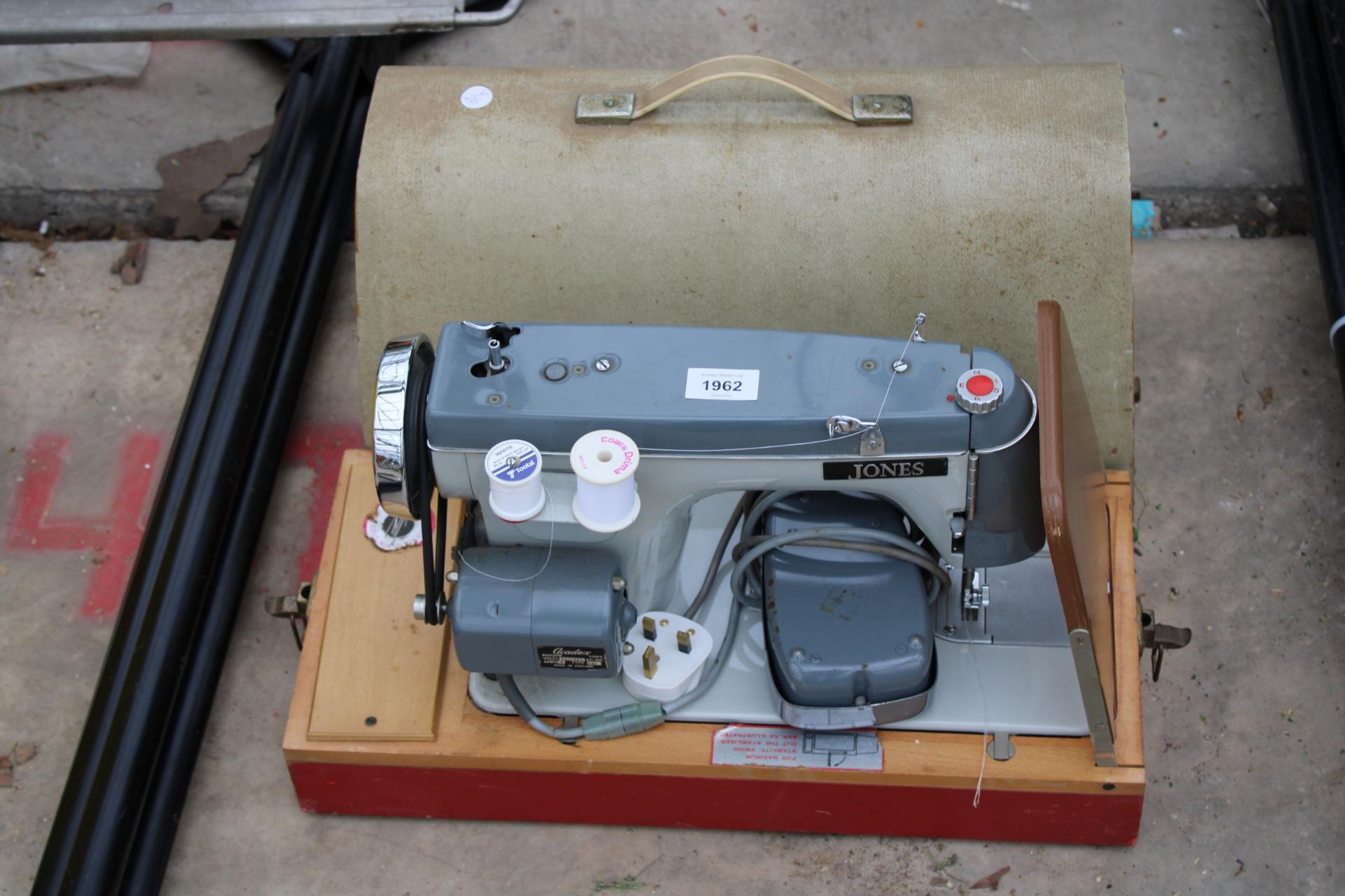 A JONES ELECTRIC SEWING MACHINE WITH FOOT PEDAL AND CARRY CASE