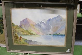A FRAMED WATERCOLUR OF A MOUNTAIN SCENE AND LAKE