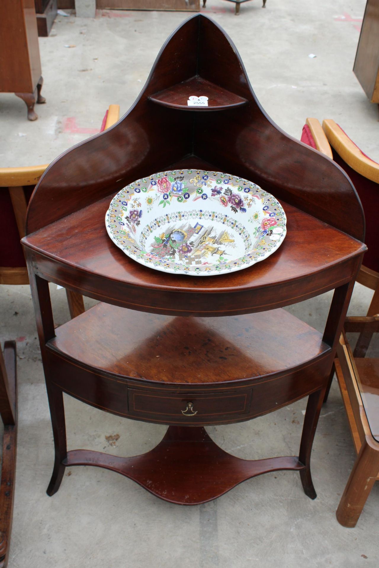 A 19TH CENTURY MAHOGANY CORNER WASHSTAND WITH CHINESE TEMPLE WASH BOWL