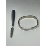 A SILVER BANGLE AND A SILVER HANDLED NAIL FILE