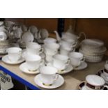 A ROYAL ALBERT "VAL DOR" EMPIRE WHITE, GOLD DECOR TEA SET TO INCLUDE CUPS, SAUCERS, SIDEPLATES,