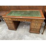 A MAHOGANY TWIN PEDESTAL DESK ENCLOSING NINE DRAWERS WITH INSET LEATHER TOP, 54" X 26"
