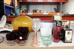 A QUANTITY OF GLASSWARE INCLUDING COLOURED WINE GLASSES, RUBY DESSERT BOWLS, A CRANBERRY JUG,