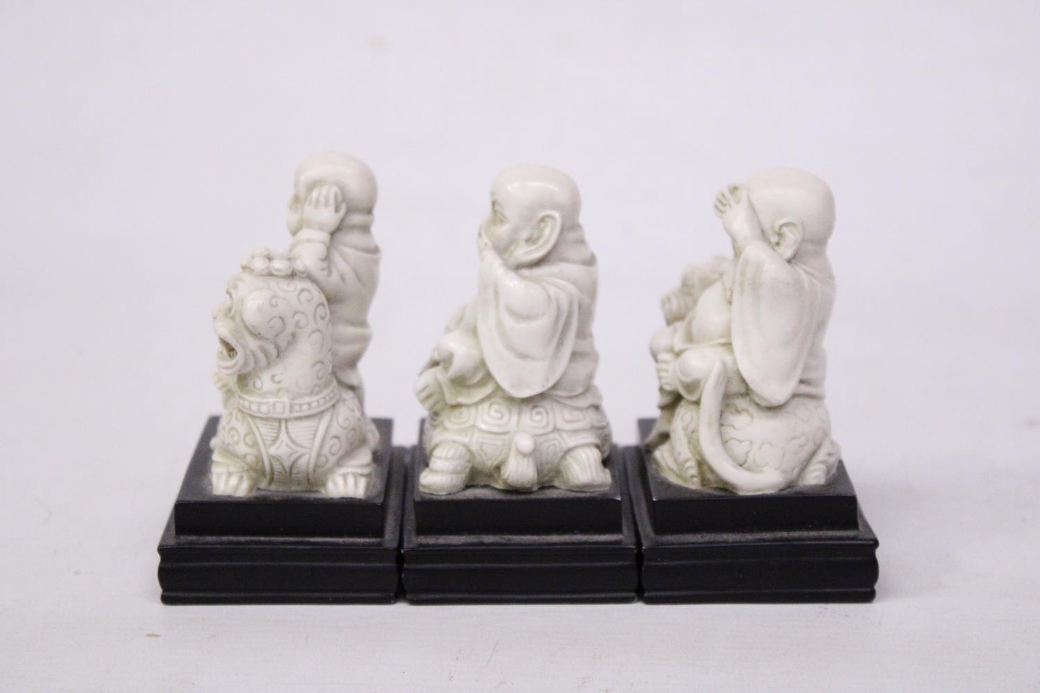 A SET OF BUDDAH FIGURES ON WOODEN PLINTHS - SEE, HEAR AND SPEAK NO EVIL - Image 2 of 5