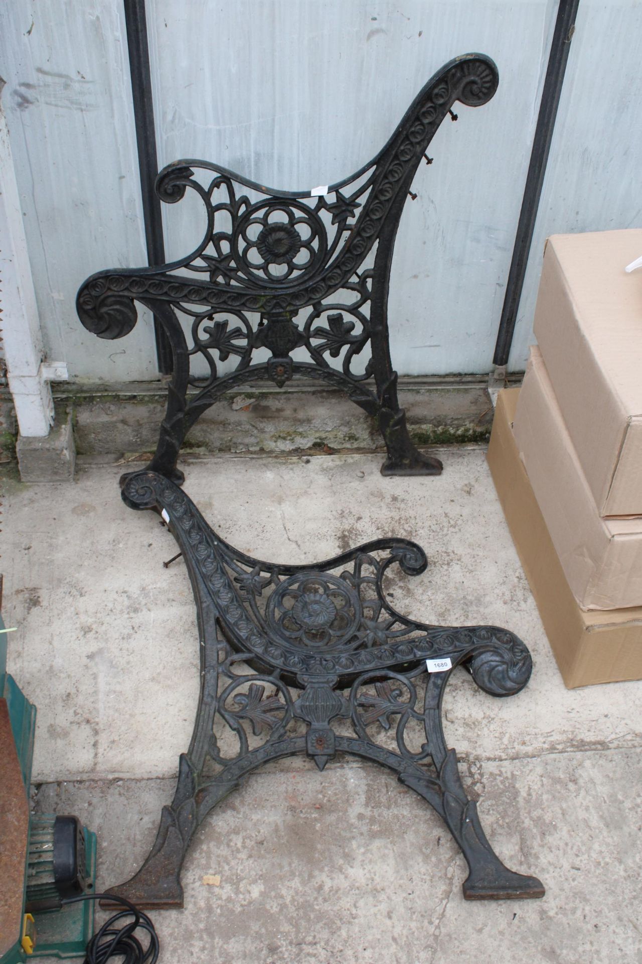 A PAIR OF DECORATIVE CAST BENCH ENDS