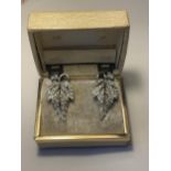 A PAIR OF 1040'S METAL RHODIUM AND CLEAR STONE EARRINGS IN A LEAF DESIGN WITH PRESENTATION BOX