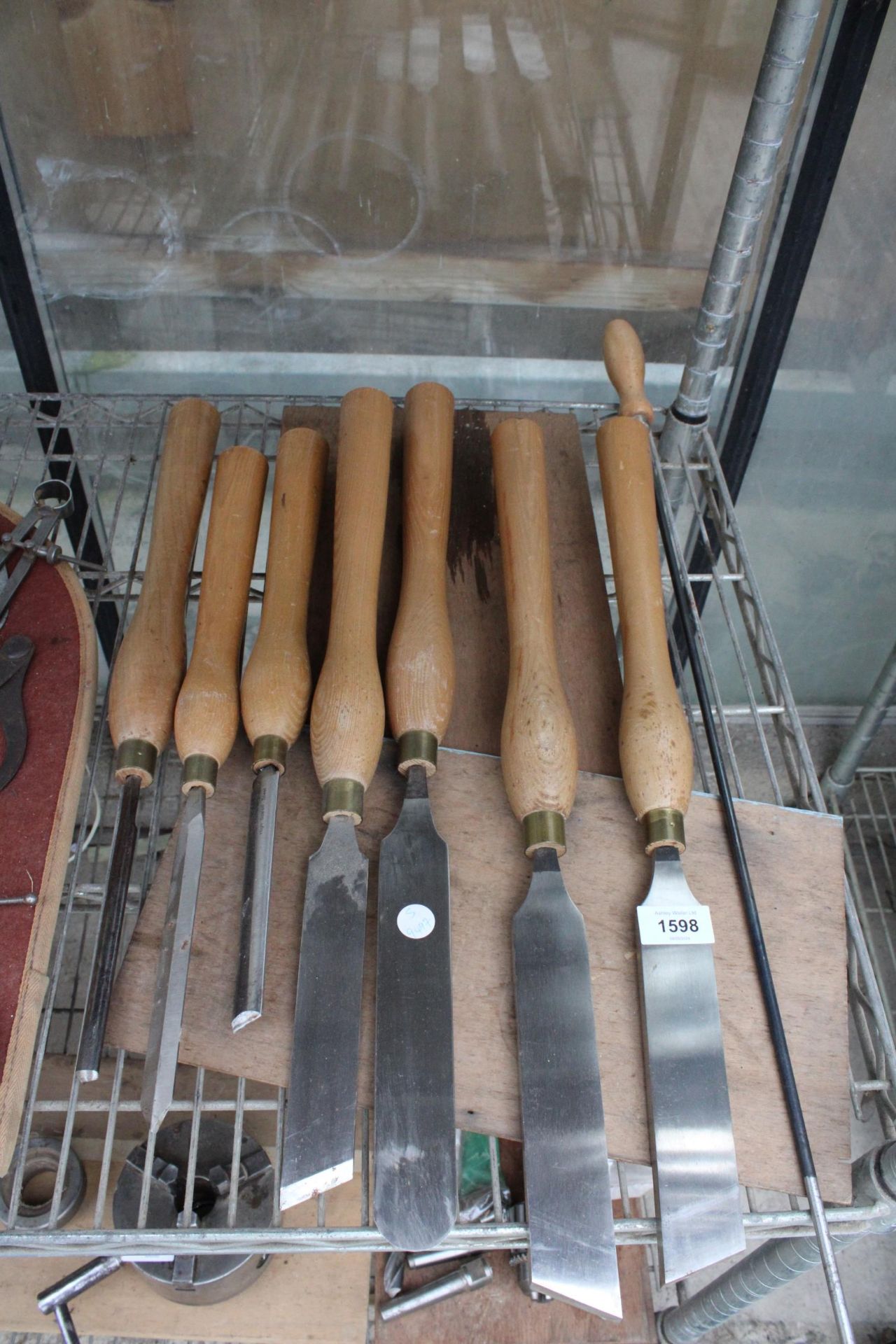 AN ASSORTMENT OF EIGHT LARGE WOODEN HANDLE LATHE TOOLS AND CHISELS