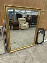 A LARGE RECTANGULAR GILT FRAMED MIRROR