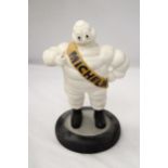 A VINTAGE MICHELIN MAN ON TYRE APPROXIMATELY 33 CM HIGH