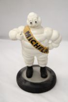 A VINTAGE MICHELIN MAN ON TYRE APPROXIMATELY 33 CM HIGH