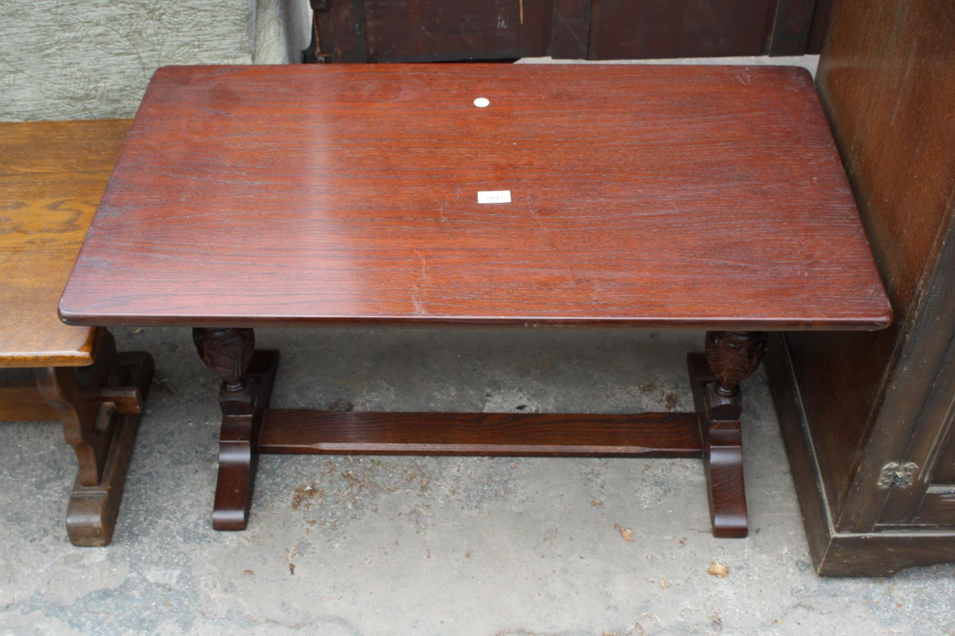 A MODERN OAK COFFEE TABLE ON BULBOUS PEDESTALS, 36" X 20"