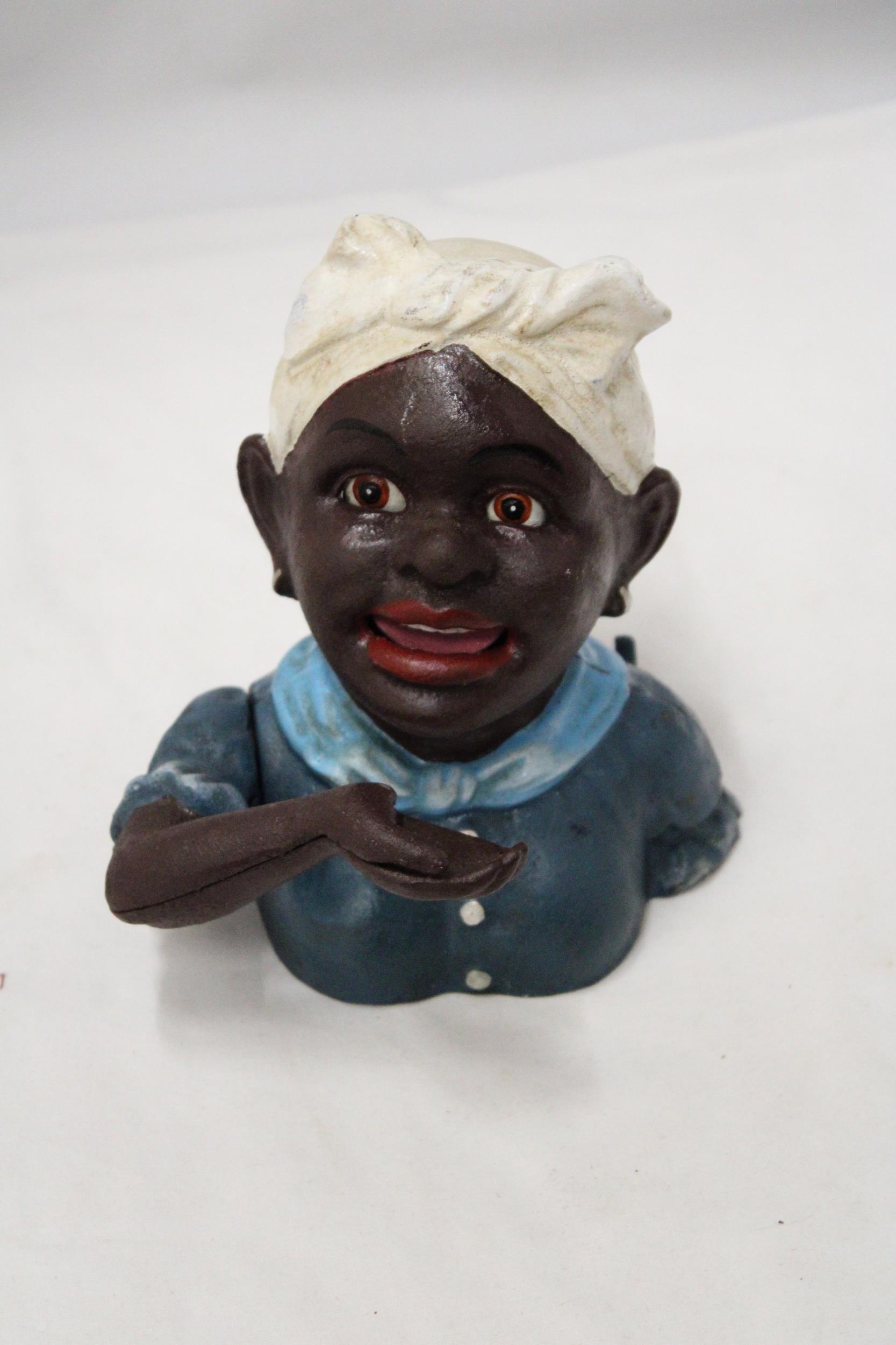 A VINTAGE CAST IRON AFRICAN AMERICAN MECHANICAL BANK