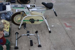 A TUNTURI EXCERISE BIKE AND A FURTHER EXERCISE MACHINE