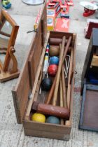 A WOODEN CROQUET SET WITH THREE JACQUES OF LONDON MALLETS