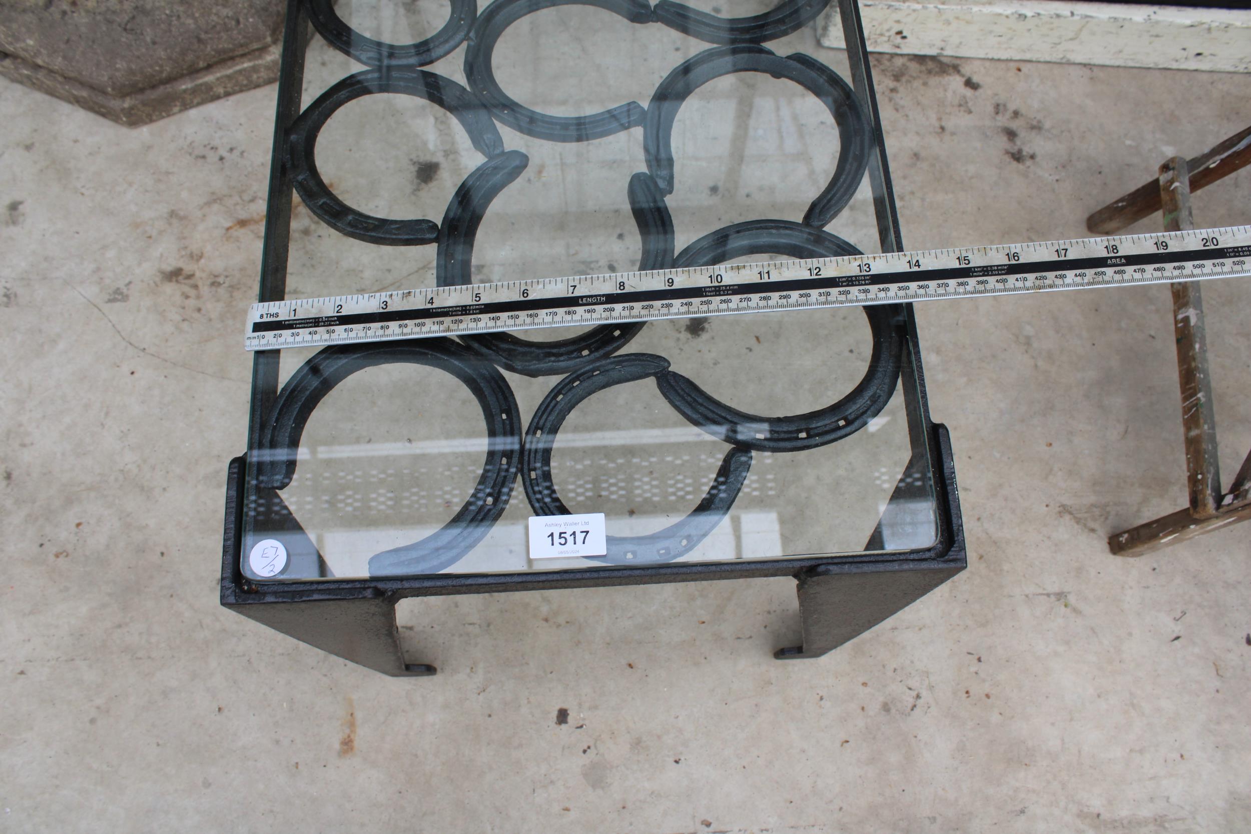 A VINTAGE STYLE METAL COFFEE TABLE WITH GLASS TOP AND FORMED FROM HORSE SHOES - Image 4 of 4
