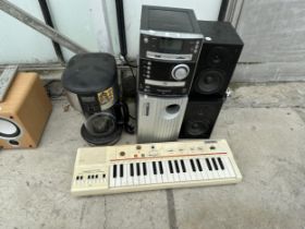 AN ASSORTMENT OF ITEMS TO INCLUDE SPEAKERS, A KEYBOARD AND A COFFEE MAKER ETC