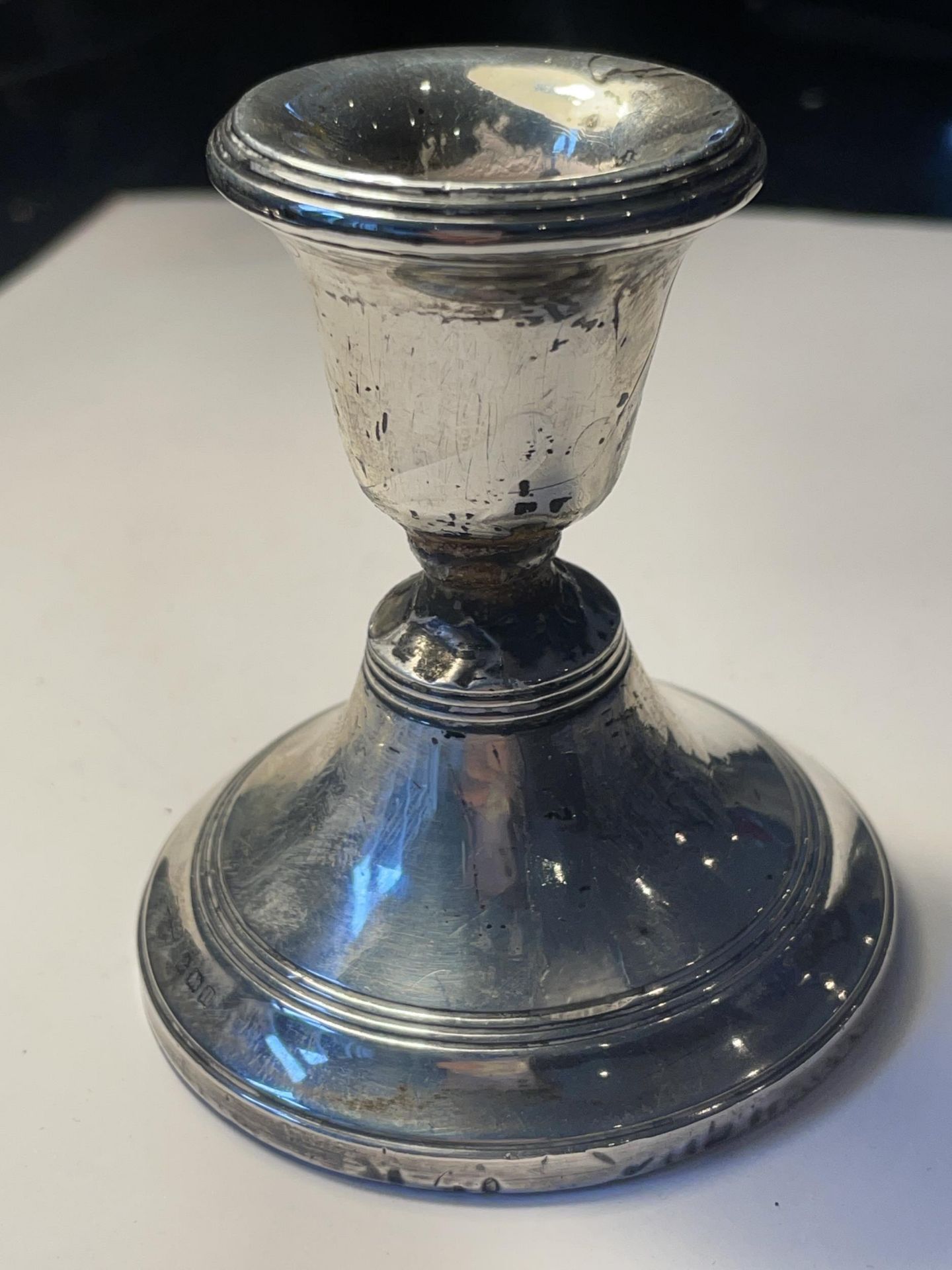 A HALLMARKED BIRMINGHAM SILVER CANDLESTICK WITH WEIGHTED BASE