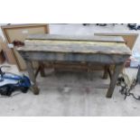 A VINTAGE WOODEN WORK BENCH WITH SMALL BENCH VICE