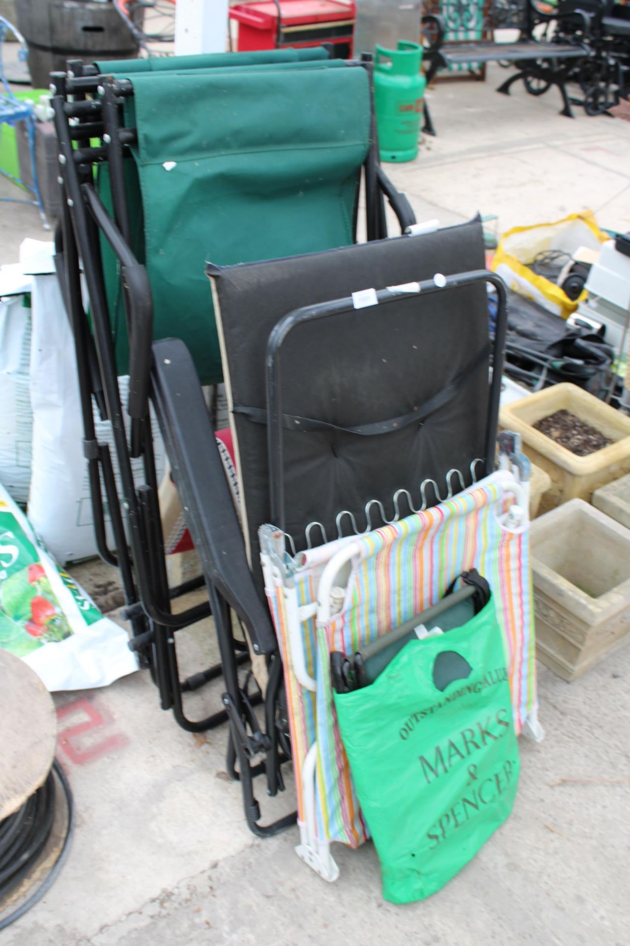 AN ASSORTMENT OF VARIOUS FOLDING CAMPING AND GARDEN CHAIRS