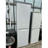 A TALL WHITE INDESIT UPRIGHT FRIDGE FREEZER