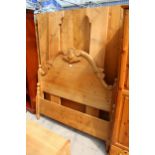 A VICTORIAN STYLE PINE 4'6" BEDSTEAD