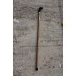 A VINTAGE WOODEN WALKING STICK WITH DOG HEAD HANDLE