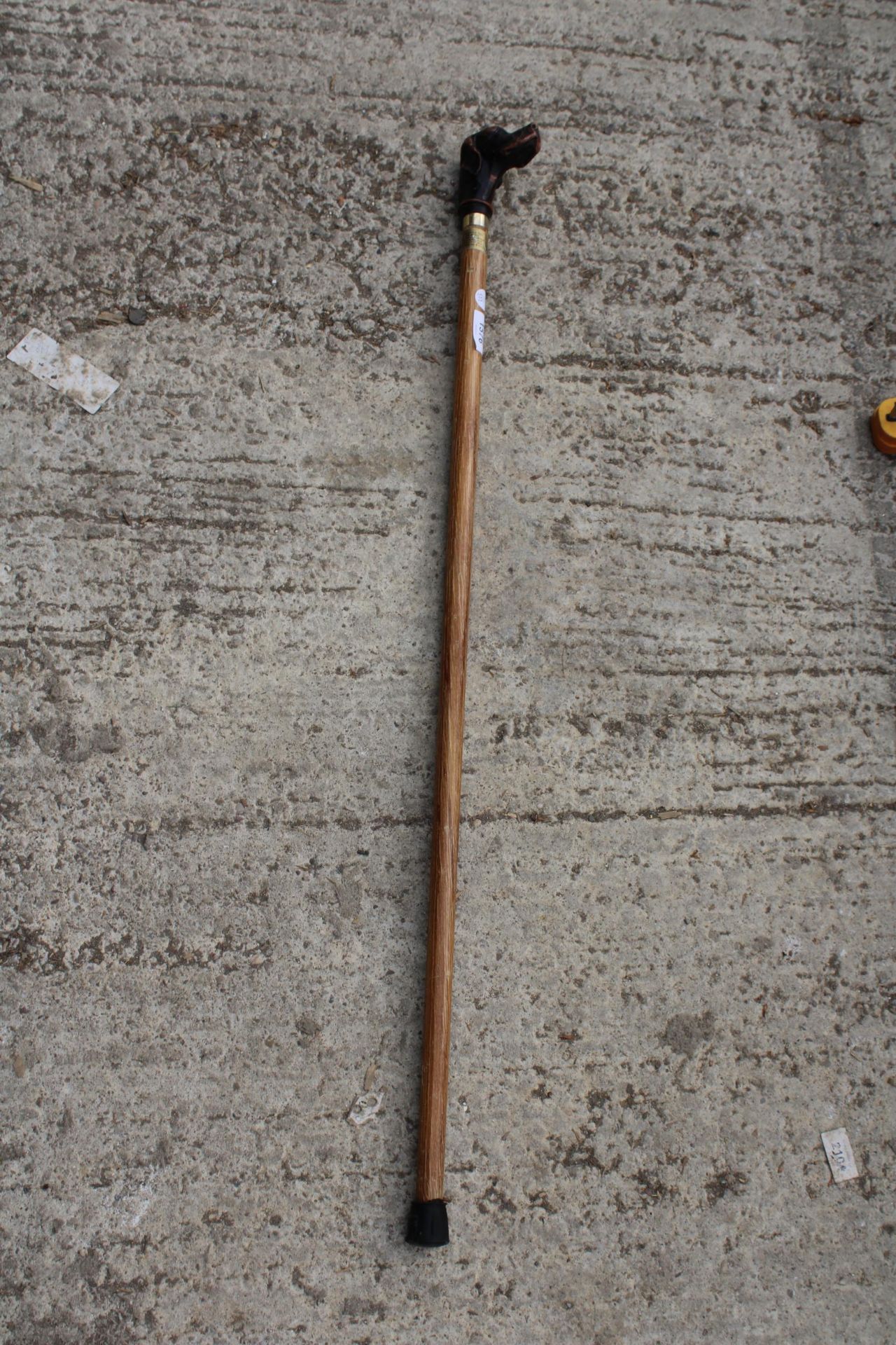 A VINTAGE WOODEN WALKING STICK WITH DOG HEAD HANDLE
