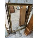 A LARGE RECTANGULAR GILT FRAMED MIRROR