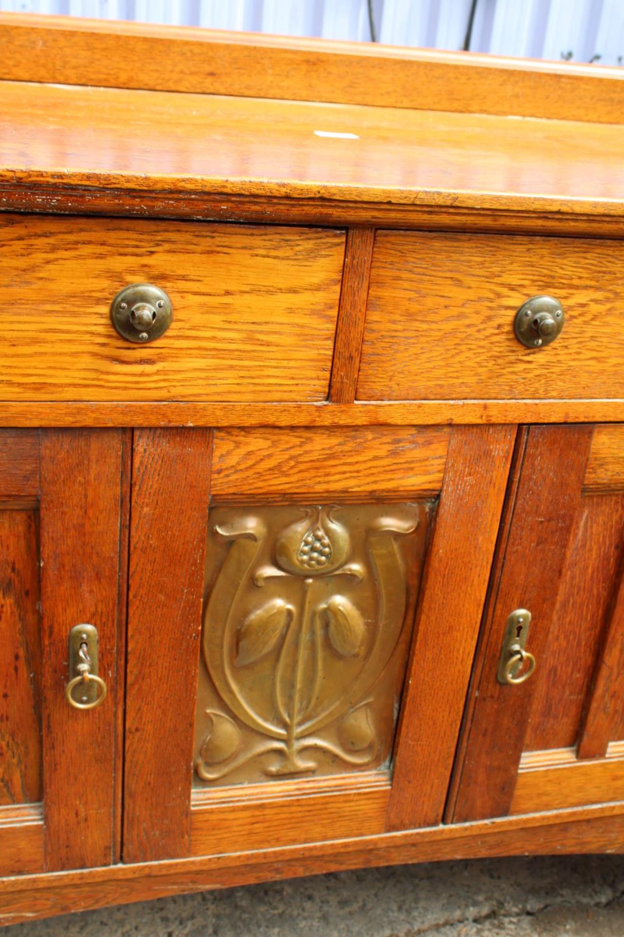 AN ART NOUVEAU OAK SIDEBOARD WITH CENTRAL EMBOSSED COPPER PANEL - 66" WIDE - Image 3 of 5